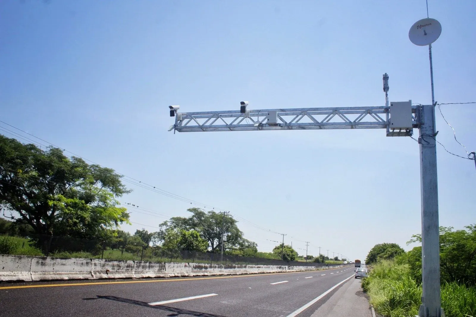 Highway arch with cameras and a radio link over a road