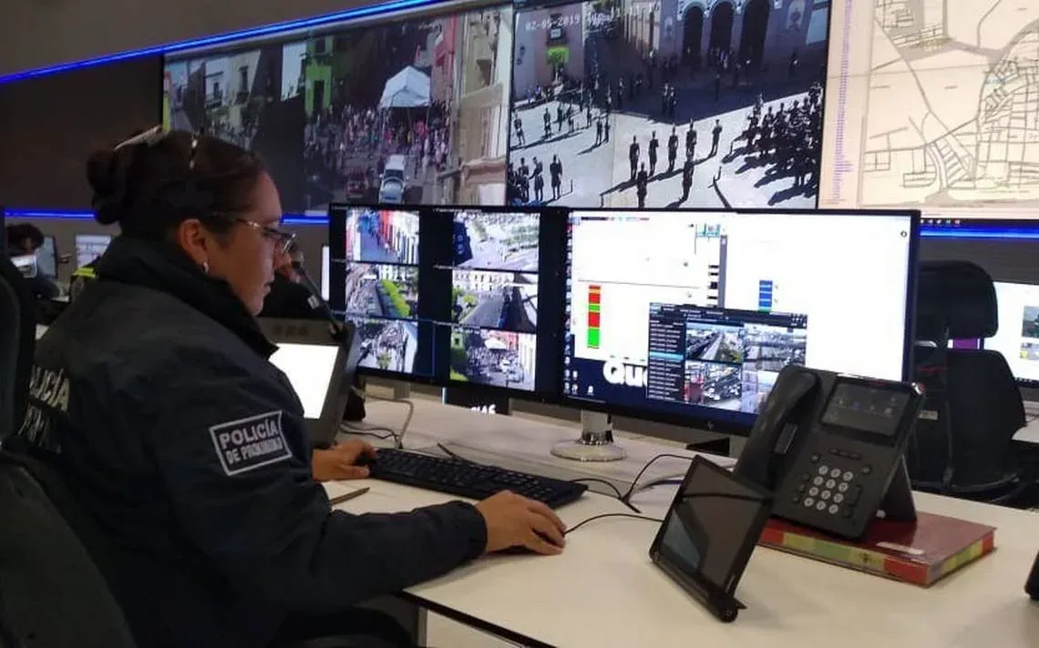 Operator at a command center monitoring console