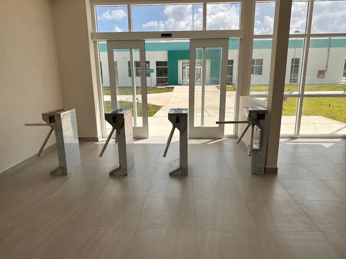 Tripod turnstiles installed at a pedestrian entrance