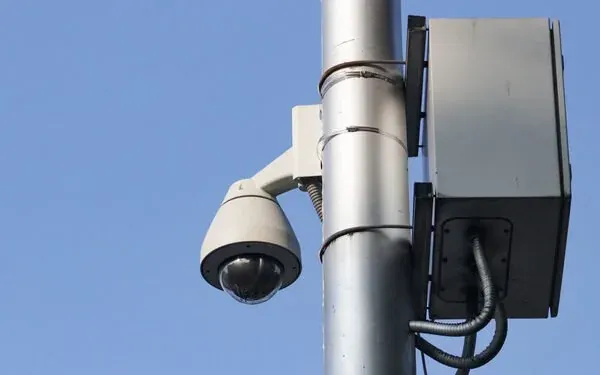 PTZ dome camera and weatherproof cabinet mounted on a pole